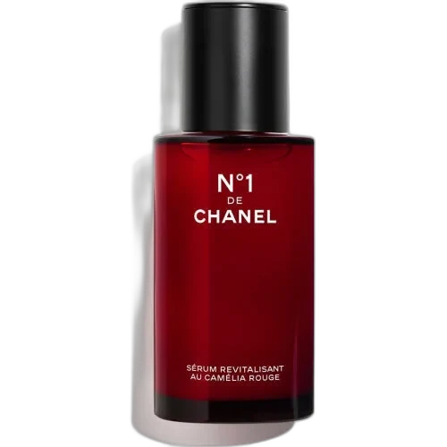 Chanel N°1 De Chanel Revitalizing Serum in eco-designed glass bottle with red camellia branding