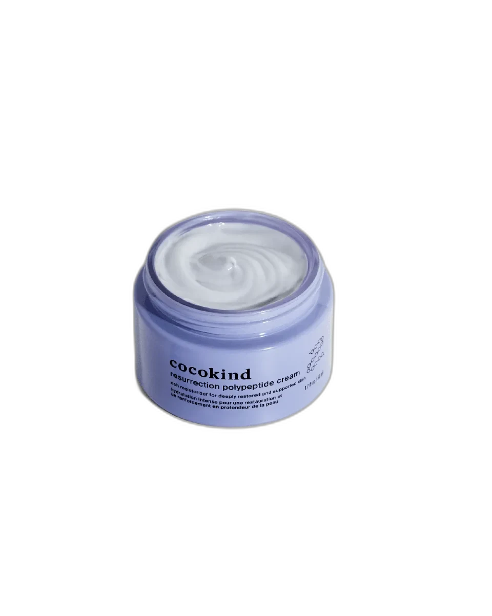Cocokind Resurrection Polypeptide Cream in distinctive purple-tinted glass jar showing the