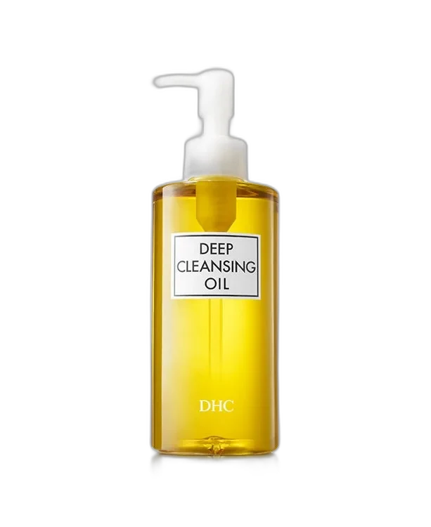 DHC Deep Cleansing Oil in a clear pump bottle showing the golden oil inside
