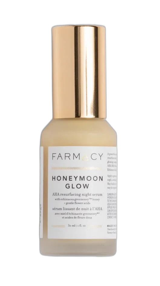 Farmacy Honeymoon Glow AHA Resurfacing Night Serum in opaque glass bottle with gold pump dispenser