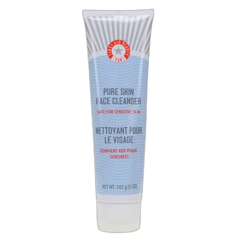 First Aid Beauty Pure Skin Face Cleanser in a white tube with red FAB branding