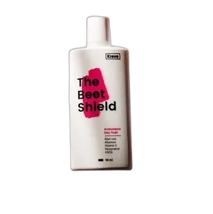 Krave Beauty Beet Shield SPF 50+ sunscreen bottle with green label and beet-colored accents