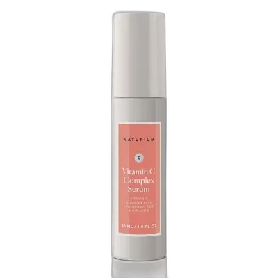 Naturium Vitamin C Complex Serum frosted glass bottle with dropper showing golden liquid