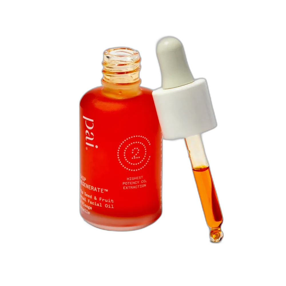 Pai Skincare Rosehip BioRegenerate Oil in an amber glass dropper bottle showing the deep orange oil