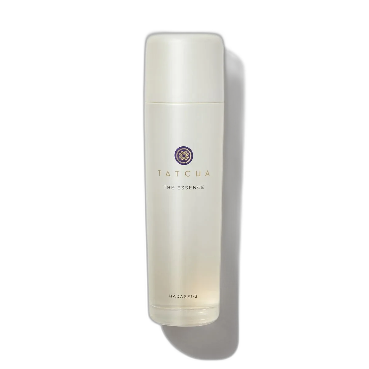 Tatcha The Essence Plumping Skin Softener in a frosted glass bottle with gold cap